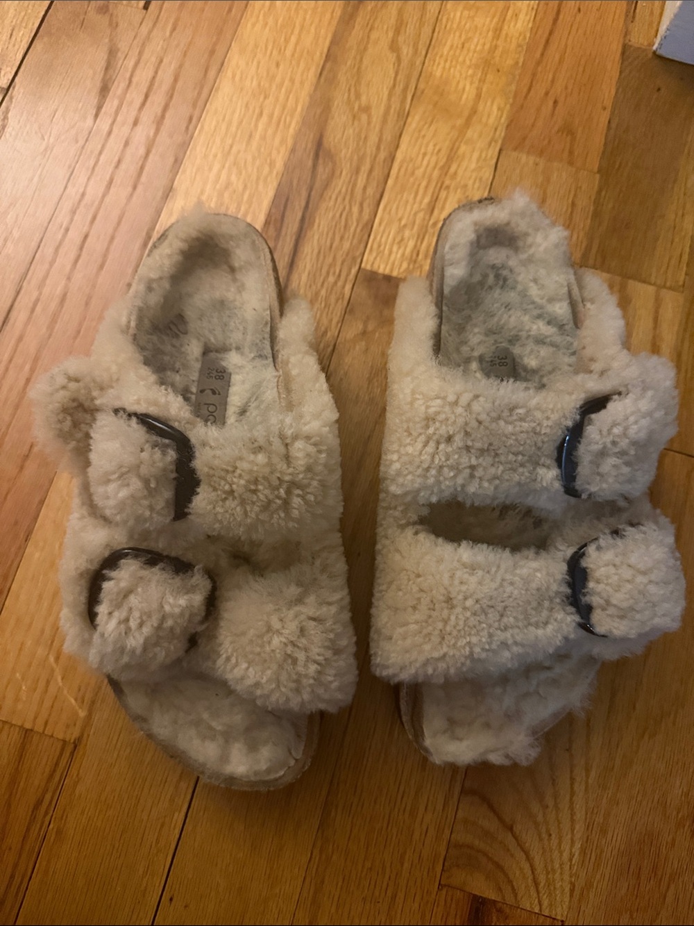 Birkenstock Shearling Double Buckle Sandals in Cream
